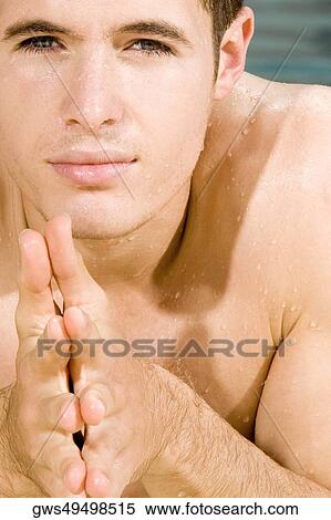 Portrait of a young man in a swimming pool View Large Photo Image Stock Photography - Portrait of a young man in a swimming pool. Fotosearch