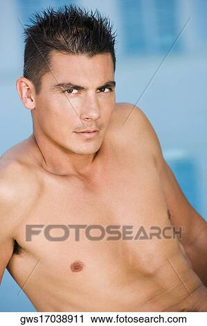 Portrait of a young man looking serious View Large Photo Image Stock Image - Portrait of a young man looking serious. Fotosearch