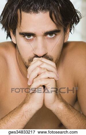 Portrait of a young man looking serious View Large Photo Image Stock Photo - Portrait of a young man looking serious. Fotosearch