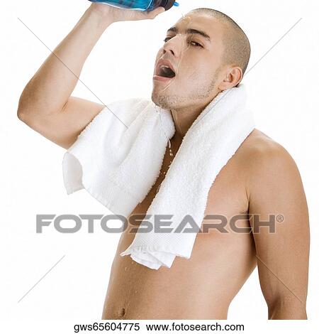 Portrait of a young man pouring water on his face View Large Photo Image Stock Photography - Portrait of a young man pouring water on his face. Fotosearch