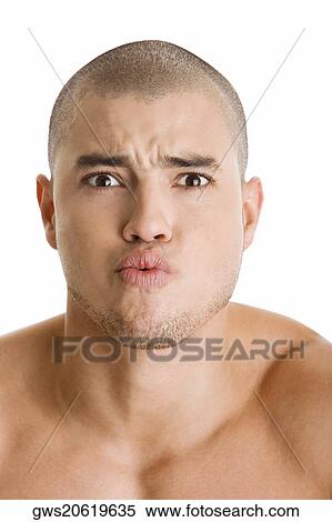 Portrait of a young man puckering his lips View Large Photo Image Stock Photography - Portrait of a young man puckering his lips. Fotosearch
