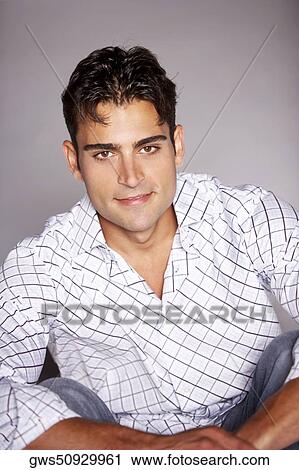 Portrait of a young man smiling View Large Photo Image Stock Image - Portrait of a young man smiling. Fotosearch