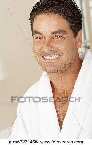 Portrait of a young man smiling View Large Photo Image Stock Photograph - Portrait of a young man smiling. Fotosearch
