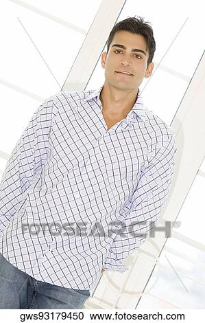 Portrait of a young man standing View Large Photo Image Stock Image - Portrait of a young man standing. Fotosearch