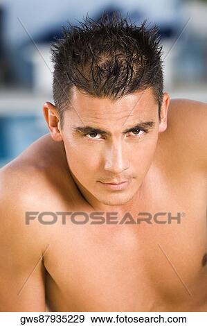 Stock Photo - Portrait of a young man staring. Fotosearch