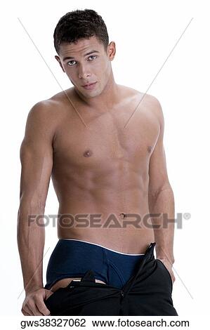 Portrait of a young man taking off his pants View Large Photo Image Stock Image - Portrait of a young man taking off his pants. Fotosearch