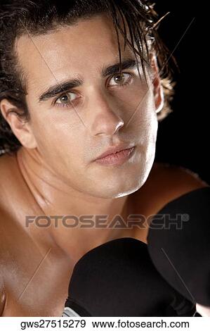 Portrait of a young man wearing boxing gloves View Large Photo Image Stock Photo - Portrait of a young man wearing boxing gloves. Fotosearch