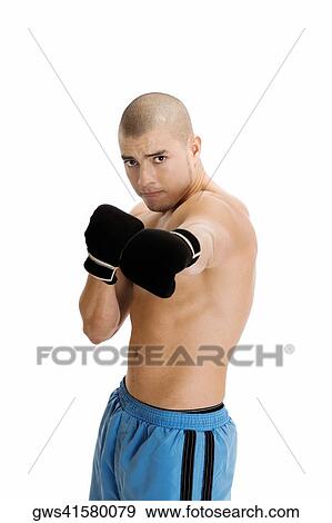 Portrait of a young man wearing boxing gloves View Large Photo Image Stock Photo - Portrait of a young man wearing boxing gloves. Fotosearch
