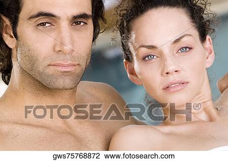Portrait of a young woman and a mid adult man at the poolside View Large Photo Image Stock Image - Portrait of a young woman and a mid adult man at the poolside. Fotosearch