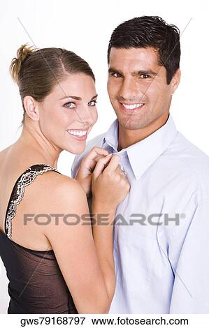 Portrait of a young woman and a mid adult man smiling View Large Photo Image Stock Photo - Portrait of a young woman and a mid adult man smiling. Fotosearch