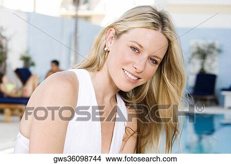 Portrait of a young woman at the poolside View Large Photo Image Picture - Portrait of a young woman at the poolside. Fotosearch