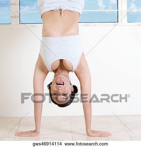 Portrait of a young woman exercising View Large Photo Image Picture - Portrait of a young woman exercising. Fotosearch