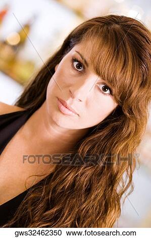 Portrait of a young woman in a bar View Large Photo Image Stock Image - Portrait of a young woman in a bar. Fotosearch