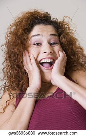 Portrait of a young woman laughing View Large Photo Image Stock Image - Portrait of a young woman laughing. Fotosearch