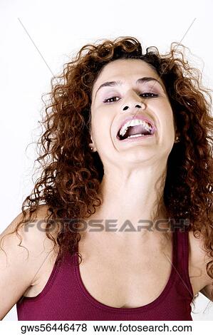 Portrait of a young woman laughing View Large Photo Image Stock Photo - Portrait of a young woman laughing. Fotosearch