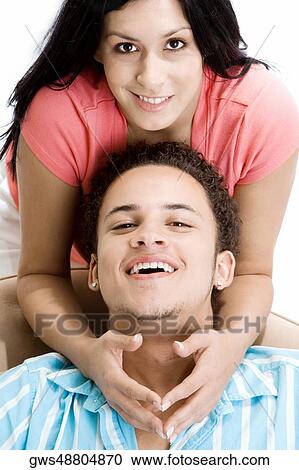 Portrait of a young woman leaning over a young man View Large Photo Image Stock Image - Portrait of a young woman leaning over a young man. Fotosearch