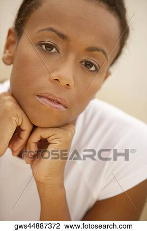 Portrait of a young woman looking sad View Large Photo Image Stock Image - Portrait of a young woman looking sad. Fotosearch