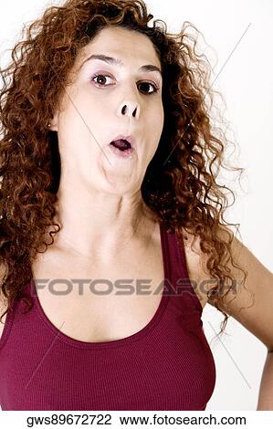 Portrait of a young woman making a face View Large Photo Image Stock Image - Portrait of a young woman making a face. Fotosearch