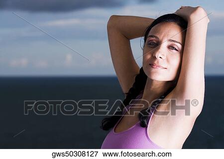 Portrait of a young woman meditating View Large Photo Image Stock Photo - Portrait of a young woman meditating. Fotosearch