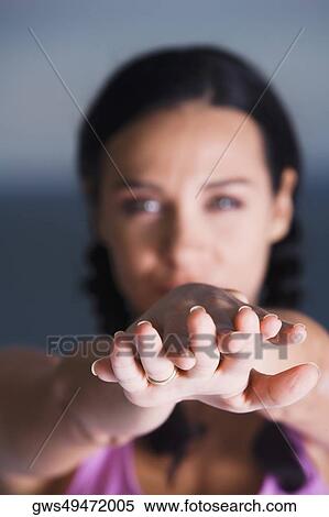 Stock Photography - Portrait of a young woman meditating. Fotosearch