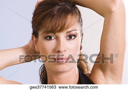Portrait of a young woman posing View Large Photo Image Stock Image - Portrait of a young woman posing. Fotosearch