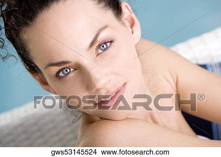Portrait of a young woman sitting at the poolside View Large Photo Image Picture - Portrait of a young woman sitting at the poolside. Fotosearch