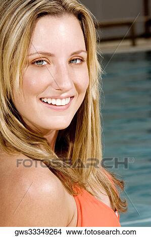 Portrait of a young woman smiling View Large Photo Image Picture - Portrait of a young woman smiling. Fotosearch