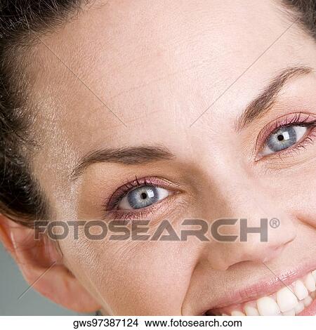 Picture - Portrait of a young woman smiling. Fotosearch