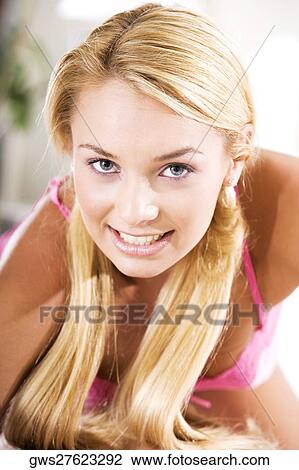 Portrait of a young woman smiling View Large Photo Image Stock Image - Portrait of a young woman smiling. Fotosearch