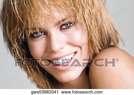 Portrait of a young woman smiling View Large Photo Image Stock Image - Portrait of a young woman smiling. Fotosearch