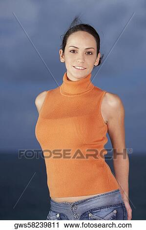 Portrait of a young woman smiling View Large Photo Image Stock Image - Portrait of a young woman smiling. Fotosearch