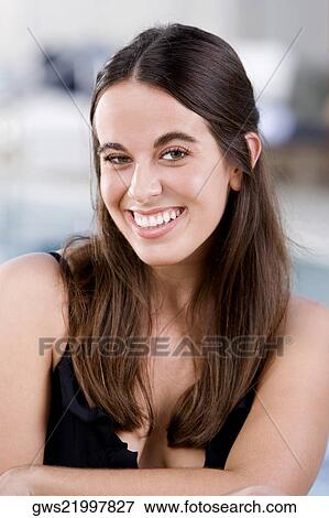 Stock Photo - Portrait of a young woman smiling. Fotosearch