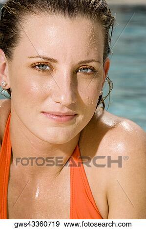 Stock Photo - Portrait of a young woman smiling. Fotosearch