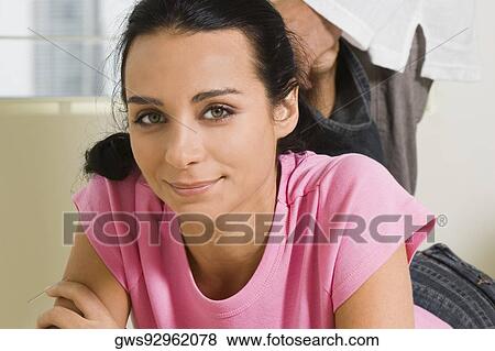 Portrait of a young woman smiling View Large Photo Image Stock Photo - Portrait of a young woman smiling. Fotosearch