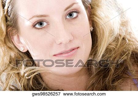Portrait of a young woman smiling View Large Photo Image Stock Photo - Portrait of a young woman smiling. Fotosearch