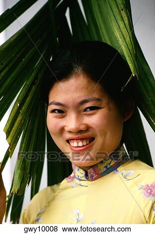 Portrait of a young woman smiling View Large Photo Image Stock Photo - Portrait of a young woman smiling. Fotosearch
