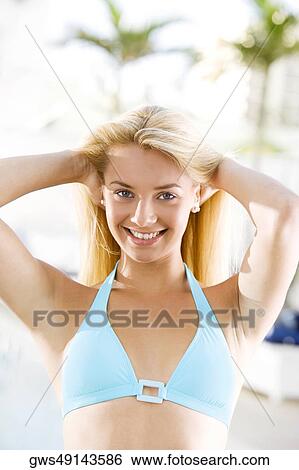 Portrait of a young woman smiling View Large Photo Image Stock Photograph - Portrait of a young woman smiling. Fotosearch