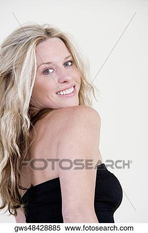 Portrait of a young woman smiling View Large Photo Image Stock Photography - Portrait of a young woman smiling. Fotosearch