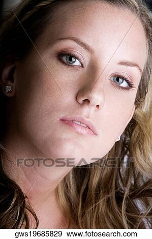 Portrait of a young woman View Large Photo Image Stock Photo - Portrait of a young woman. Fotosearch