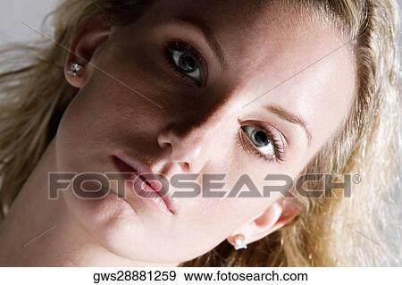Stock Photo - Portrait of a young woman. Fotosearch
