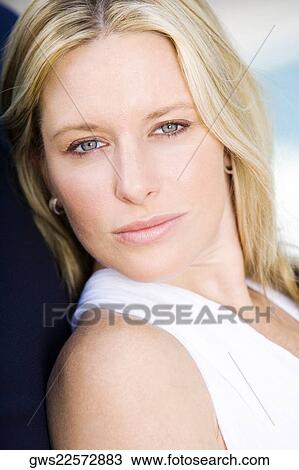 Stock Image - Portrait of a young woman thinking. Fotosearch