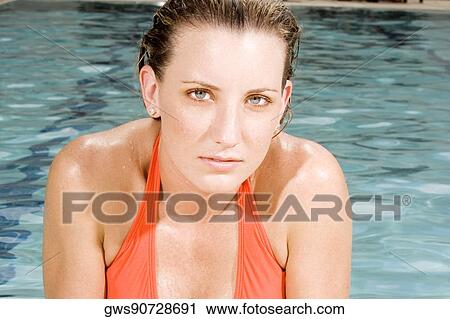 Stock Image - Portrait of a young woman thinking. Fotosearch