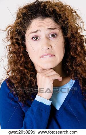 Portrait of a young woman with her hand on her chin View Large Photo Image Stock Photography - Portrait of a young woman with her hand on her chin. Fotosearch
