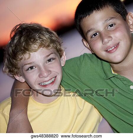 Portrait of two boys smiling View Large Photo Image Stock Image - Portrait of two boys smiling. Fotosearch