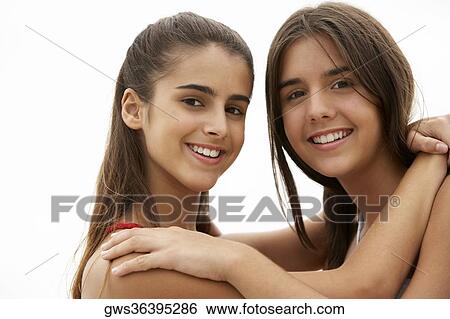 Portrait of two girls smiling View Large Photo Image Stock Photograph - Portrait of two girls smiling. Fotosearch