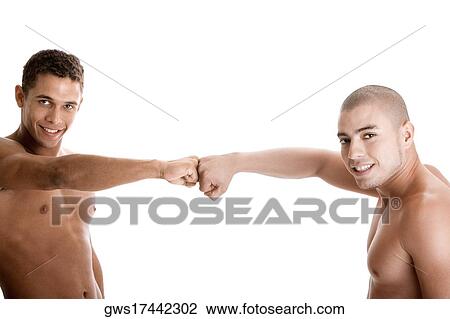 Portrait of two young men with their fists together View Large Photo Image Stock Image - Portrait of two young men with their fists together. Fotosearch