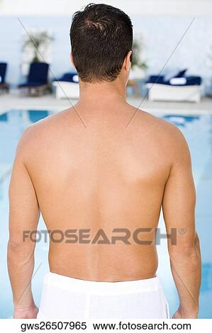 Rear view of a mid adult man View Large Photo Image Stock Photography - Rear view of a mid adult man. Fotosearch