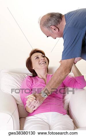 Senior couple holding hands looking at each other View Large Photo Image Stock Image - Senior couple holding hands looking at each other. Fotosearch