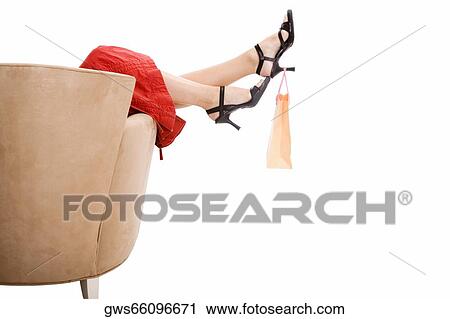 Shopping bag hanging from the heal of a woman's shoe View Large Photo Image Stock Image - Shopping bag hanging from the heal of a woman's shoe. Fotosearch