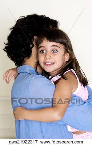 Side profile of a father carrying his daughter View Large Photo Image Stock Photo - Side profile of a father carrying his daughter. Fotosearch